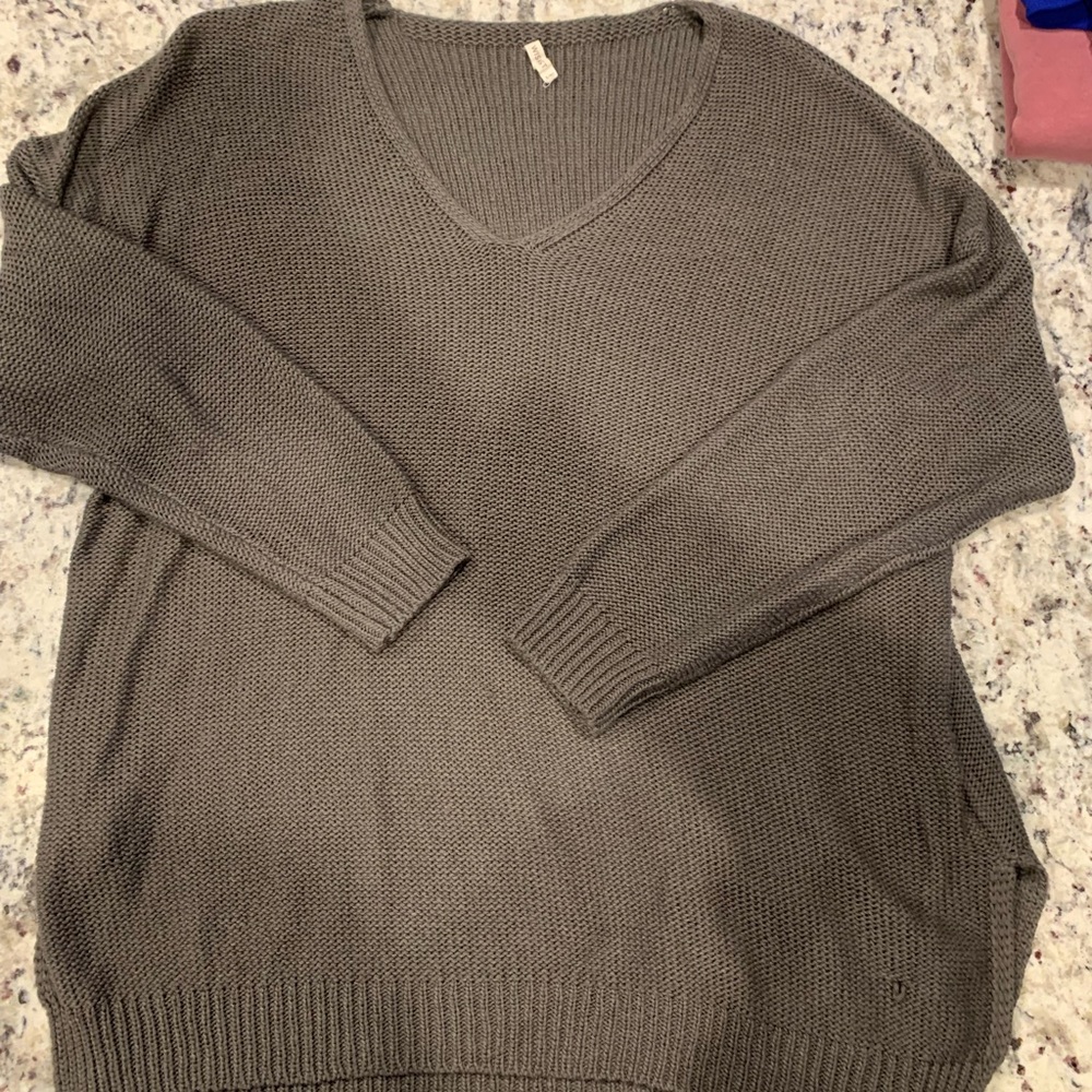 Boutique brown oversized sweater with a couple of small snags